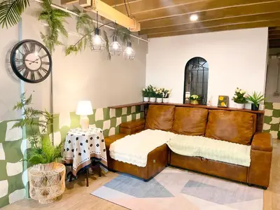 a bedroom with a large bed and a table at 4BR 8PAX Near BTS Mochit MRT Chatuchak Union Mall in Sathani Bang Su