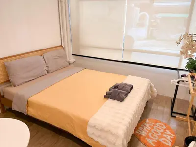 a bedroom with a bed with a teddy bear on it at 4BR 8PAX Near BTS Mochit MRT Chatuchak Union Mall in Sathani Bang Su