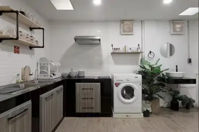 a kitchen with a washing machine and a sink at 4BR 8PAX Near BTS Mochit MRT Chatuchak Union Mall in Sathani Bang Su