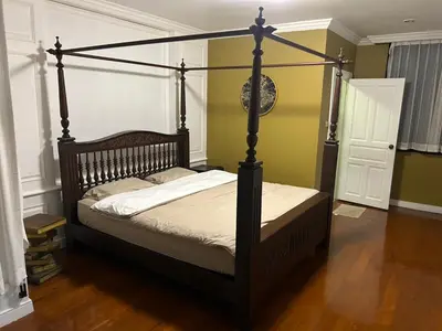 a bedroom with a canopy bed in a room at The oasis on 8 3 bedrooms private zone in Bang Kapi