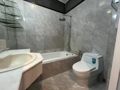 a bathroom with a toilet and a tub and a sink at The oasis on 8 3 bedrooms private zone in Bang Kapi