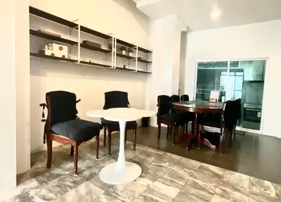 a dining room with a white table and chairs at Impact Arena & DMK - 4BR 12pax Home 55