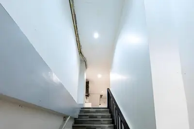 a staircase in a building with a stair case at XX Oh My Nap BTS NANA in Makkasan