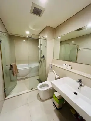a bathroom with a toilet and a sink and a shower at Thong Lor Luxury condo with Swimming Pool, Fast Wifi in Sathani Khlong Tan