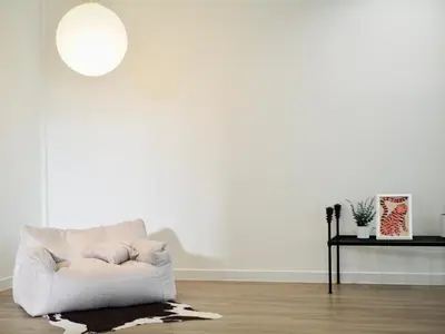 a white living room with a white couch at Cozy home with car parking near MRT Lat Phrao & Phawana in Bangkok