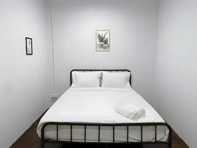 a bed in a white room with a white mattress at xx BAO The Giant Swing - เสาชิงช้า ศาลเจ้าพ่อเสือ 1 in Bangkok