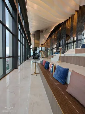 a lobby with a long bench with pillows on it at Brand New 2 bedroom near Paragon in Pratunam