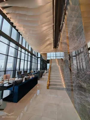 a lobby with a staircase in a building at Brand New 2 bedroom near Paragon in Pratunam