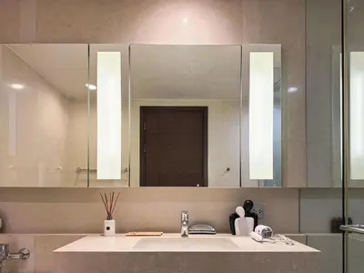 a bathroom with a sink and a large mirror at Near BTS - High Floor - Pool and Gym - Sontana in Bangkok