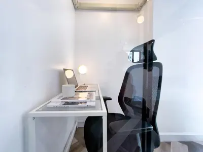 a white desk with a chair and a laptop at Prime Chidlom 50sqm l Large Kitchen l Walk to BTS l Wifi in Bangkok