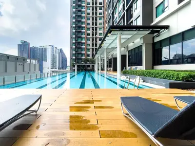 a swimming pool on the roof of a building at 150 m to MRT l Workspace and Kitchen l Suana l Sontana in Bangkok