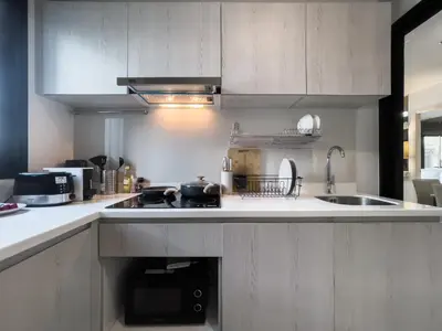 a kitchen with a sink and a stove top oven at 150 m to MRT l Workspace and Kitchen l Suana l Sontana in Bangkok