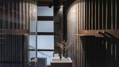 a bathroom with a sink and a window at Vanich House - Mechanic's Room in Bangkok