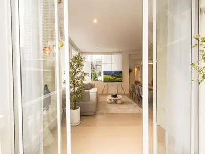 two views of a living room and a dining room at 3 Bedroom for 6 Guests Family in the Heart of Sathorn in Bangkok