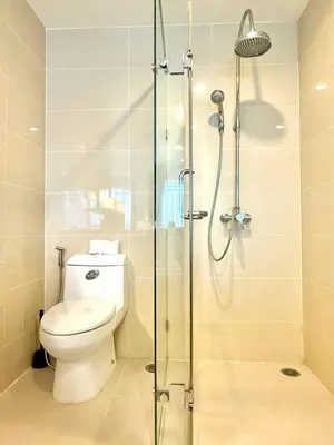 a bathroom with a toilet and a glass shower at 3BD3BA Condo|City View|Hot Tub|7-11, PoolGym, Mall in Makkasan