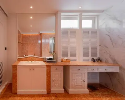 a white bathroom with a sink and a window at Presidential Suite | 5 min BTS, Sun-Room| 159sqm in Khlong Toei