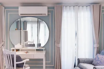 a room with a mirror and a desk and a chair at Chic 1BR |5 min BTS, 2 min to spa|500Mbps&bath-tub in Khlong Toei