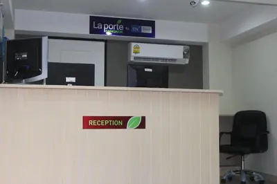 a reception counter in an office with a rejection sign at La Porte Hotel Bangkok in Bangkok