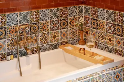 a bathroom with a sink and a tub with tiles at Contemporary Eastern 1BR 5 min BTS| All Essential in Khlong Toei