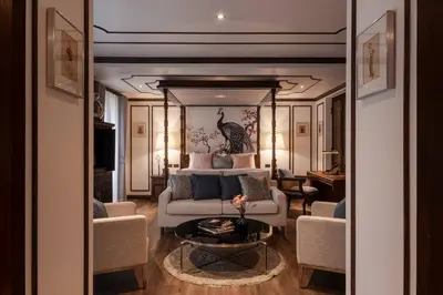 a living room with a couch and a bed at Contemporary Eastern 1BR 5 min BTS| All Essential in Khlong Toei