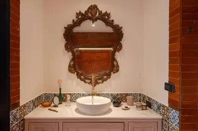 a bathroom with a sink and a mirror at Contemporary Eastern 1BR 5 min BTS| All Essential in Khlong Toei
