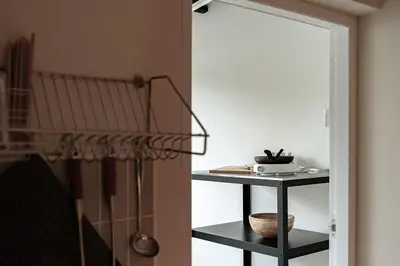 a room with a mirror and a table with a shelf at 2BR APT on 2nd floor for 6 ppl in Bangkok