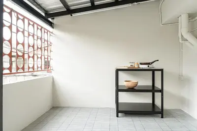 a black shelf in a room with a window at 2BR APT on 2nd floor for 6 ppl in Bangkok