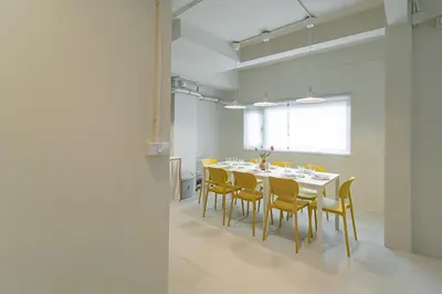 a dining room with a table and yellow chairs at A 3BR apartment for 8 pax on 3Floor in Bangkok