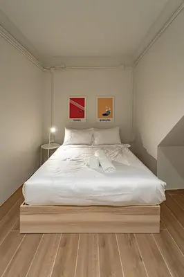 a bedroom with a large white bed with two towels on it at A 3BR apartment for 8 pax on 3Floor in Bangkok