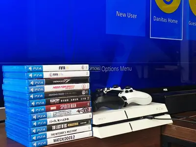 a stack of video games and a pile of dvds at Danita's Home Bangkok in Bangkok