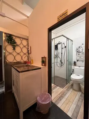 a bathroom with a shower and a toilet at LA CASA in China town in Bangkok