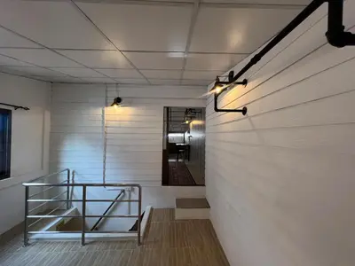 a hallway with a stair case in a room at LA CASA in China town in Bangkok