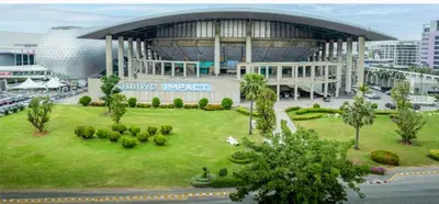 a large building with a park in front of it at Hotel pretty rooms in Pak Kret