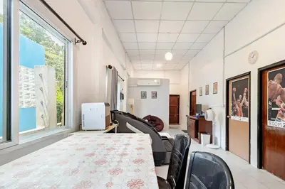 a room with a table and chairs and a large window at Room 1 Homestay Near BTS Bangwa in Bangkok