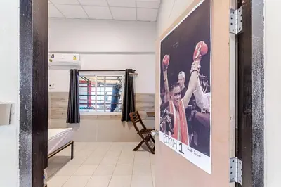 a poster of a basketball team hanging on a wall in a room at Room 1 Homestay Near BTS Bangwa in Bangkok
