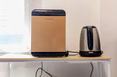 a router and a toaster sitting on a shelf at Room 1 Homestay Near BTS Bangwa in Bangkok
