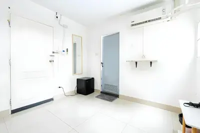 a white room with a shower and a door at XX Oh My Nap Nana Soi 3 -โอมาย แนปเทล ซอย 3 in Makkasan