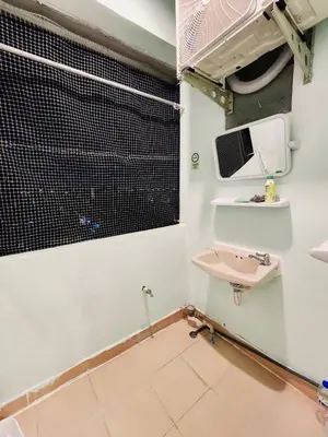 a bathroom with a sink and a window at 706-STP Homely room Free Wi-Fi and Near BTS in Bangkok