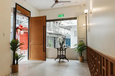 an office entrance with a table and a door at Samranscape in Bangkok