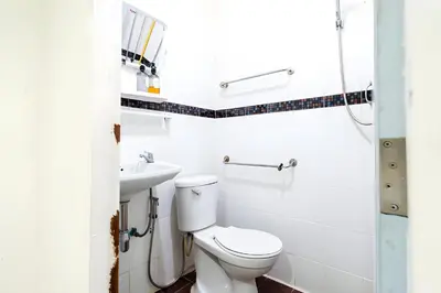 a bathroom with a toilet and a sink at XX Oh My Nap Sukhumvit 3 - Nana Bangkok in Makkasan