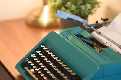 a blue calculator sitting on top of a table at Pillow & Paper in Bangkok