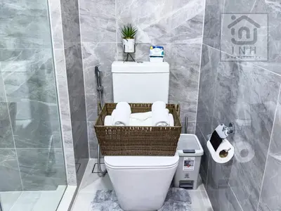 a bathroom with a toilet with a basket on it at \u66b9\u7f57\u767e\u4e3d\u5bab\u5962\u534e\u516c\u5bd3 Siam Paragon Luxury Stay #W08 in Pratunam