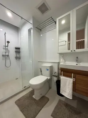 a bathroom with a toilet and a shower and a sink at 6th Avenue Sukhumvit BKK 403 BTS Asoke Nana MRT Sukhumvit in Bangkok