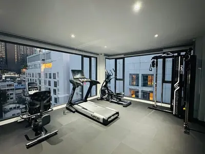 an apartment gym with a view of a city at 6th Avenue Sukhumvit BKK 403 BTS Asoke Nana MRT Sukhumvit in Bangkok