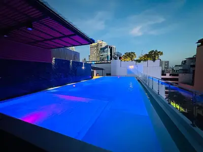 a large swimming pool on the roof of a building at 6th Avenue Sukhumvit BKK 403 BTS Asoke Nana MRT Sukhumvit in Bangkok