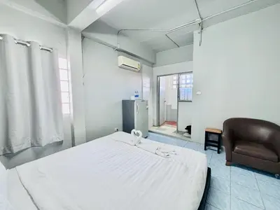 a hospital room with a bed and a chair at Onnut36 Apartment Panasan in Amphoe Phra Khanong