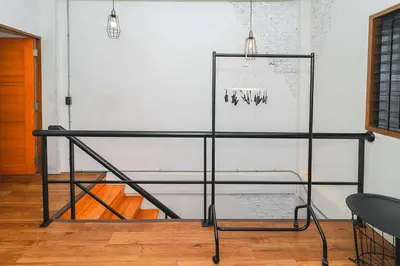 a glass table with a chandelier in a room at Rose Loft Family or friends 6 person in Thonhuri