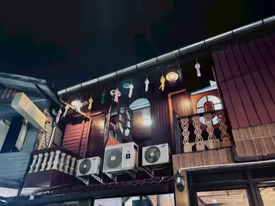 a balcony of a building with some items on it at Sukhum Ban Songthai in Bangkok