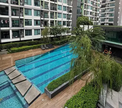 an overhead view of a swimming pool in a building at Bangkok apartment in Bangkok