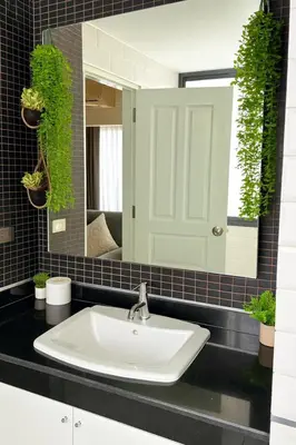 a bathroom with a sink and a mirror at New Renovated 2 Beds Amazing Balcony View Nana BTS in Bangkok